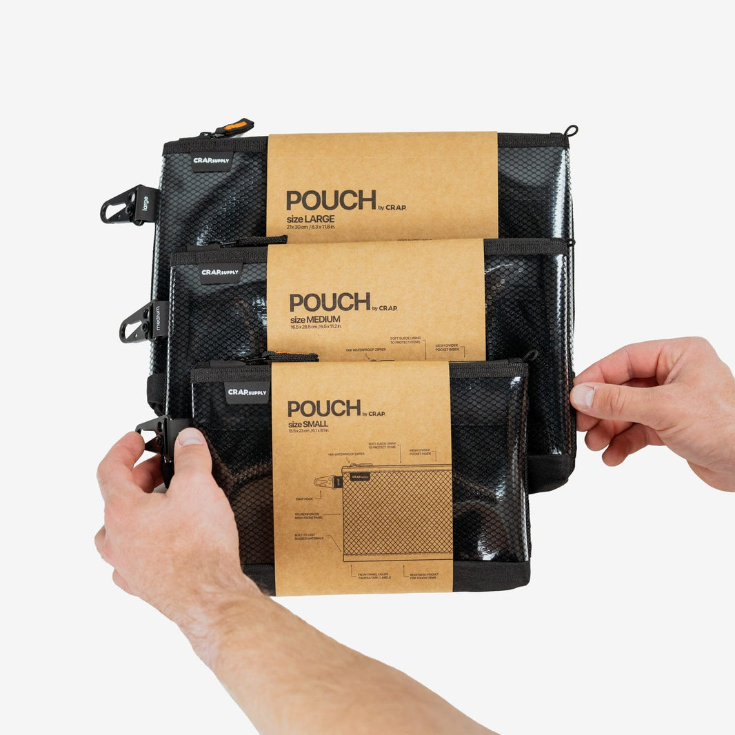 Three labeled CRAP pouches clipped to a film production cart with colored tape tags